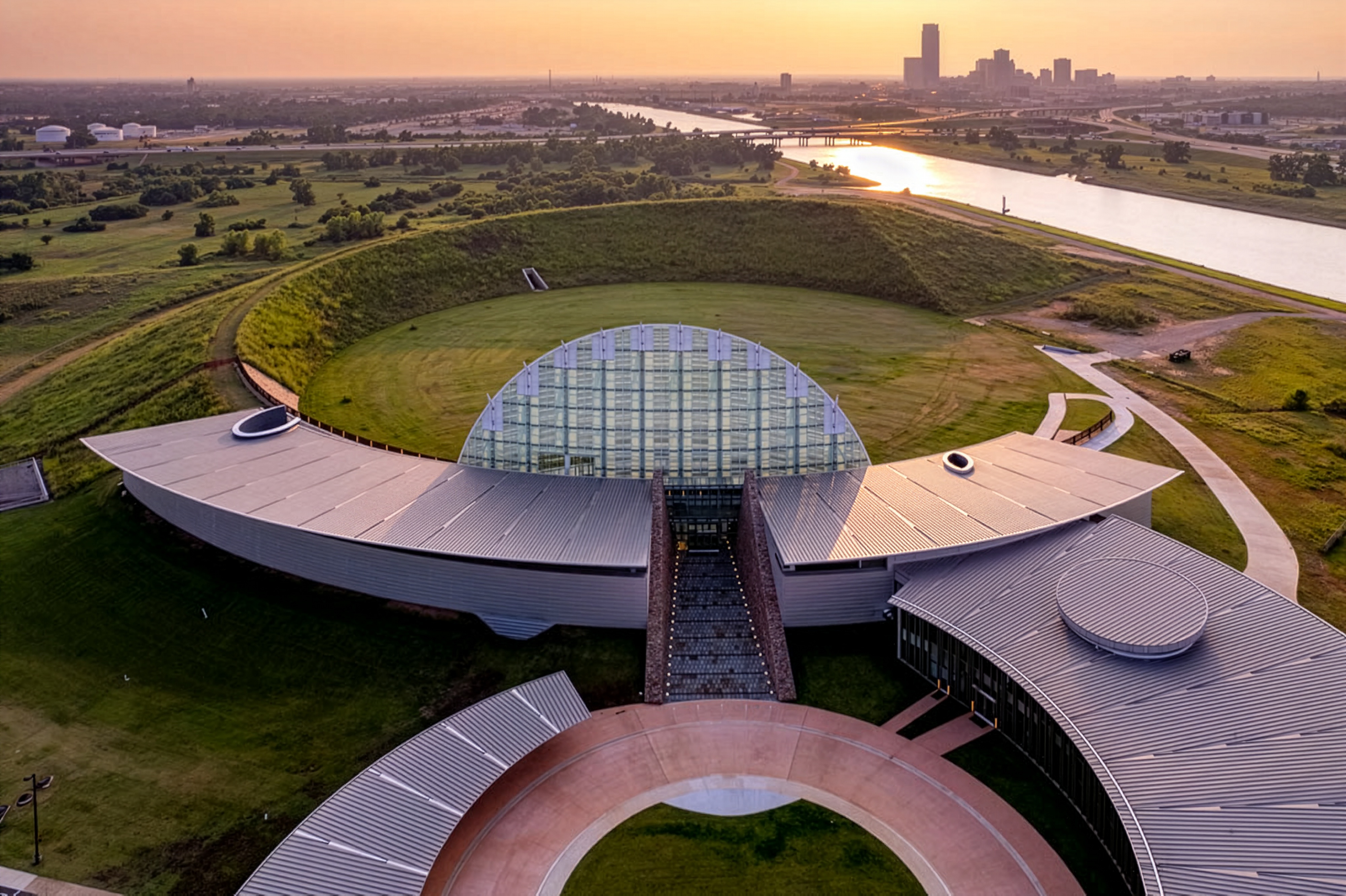 Aerial view of the First Americans Museum at sunset along the Oklahoma River